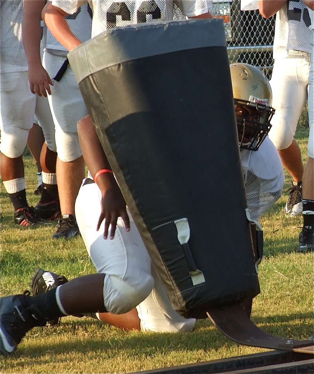 Image: Senior lineman Adrian “BoBo” Reed is fierce during the 7-man sled workout.