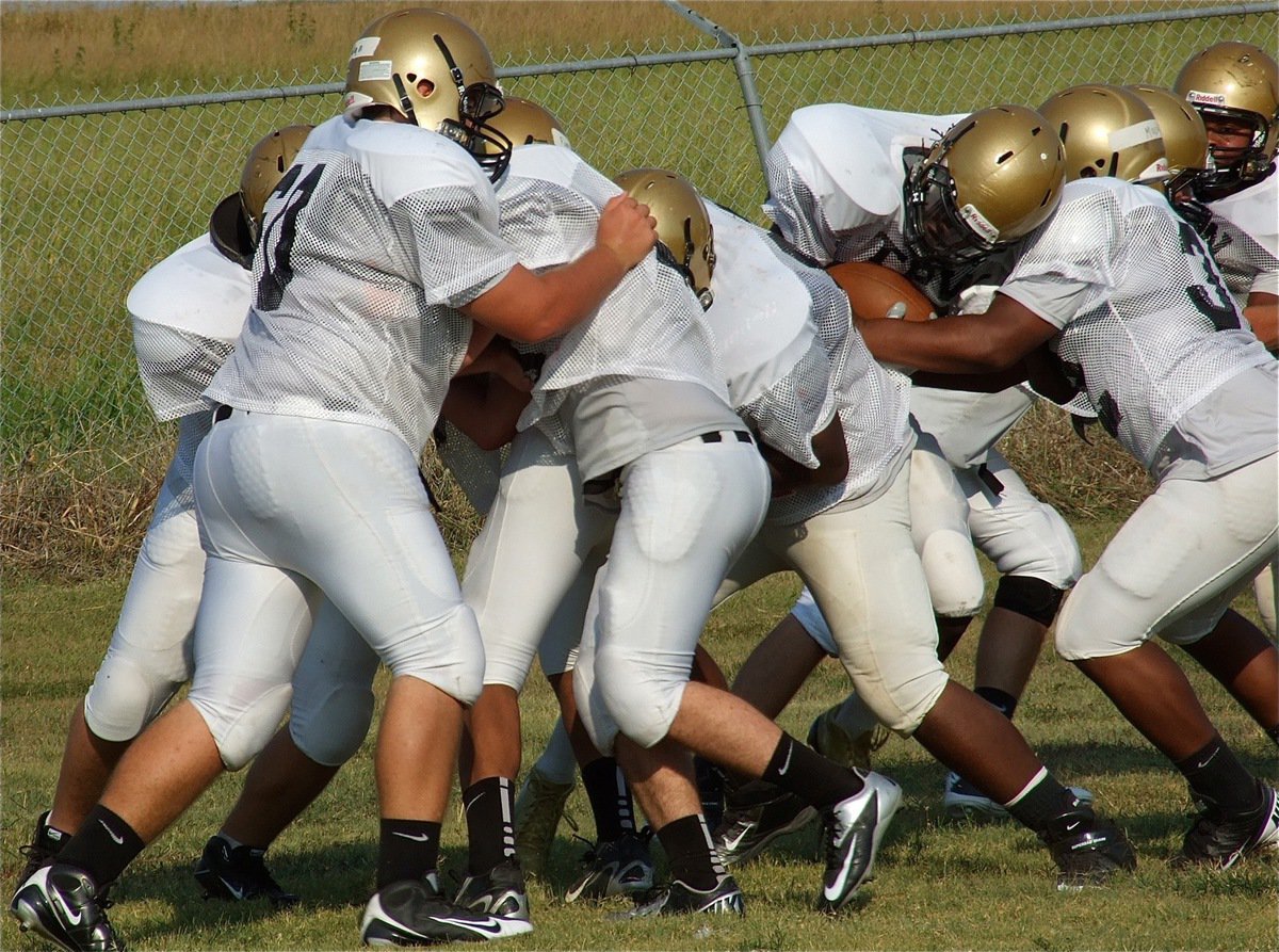 Image: Ryeem Walker tries to punch thru during a drill.