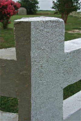 Image: A closer look of a corner post shows different textures that can be achieved while constructing the fence. Plus, a side-by-side comparison of shows the original sandy-white colorant added to the concrete mix contrasted with a painted coat of white-wash on the right.