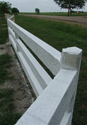 Image: A five-sided corner post allows the fence to pivot and navigate around property lines to completely encompass the property.