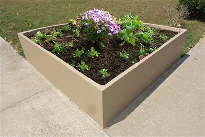 Image: Custom shaped planters can be installed to elegantly enhance any property.