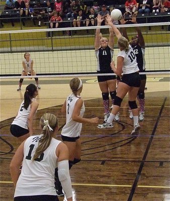 Image: Lady Gladiator Madison Washington(10) meets the challenge at the net from Hubbard.