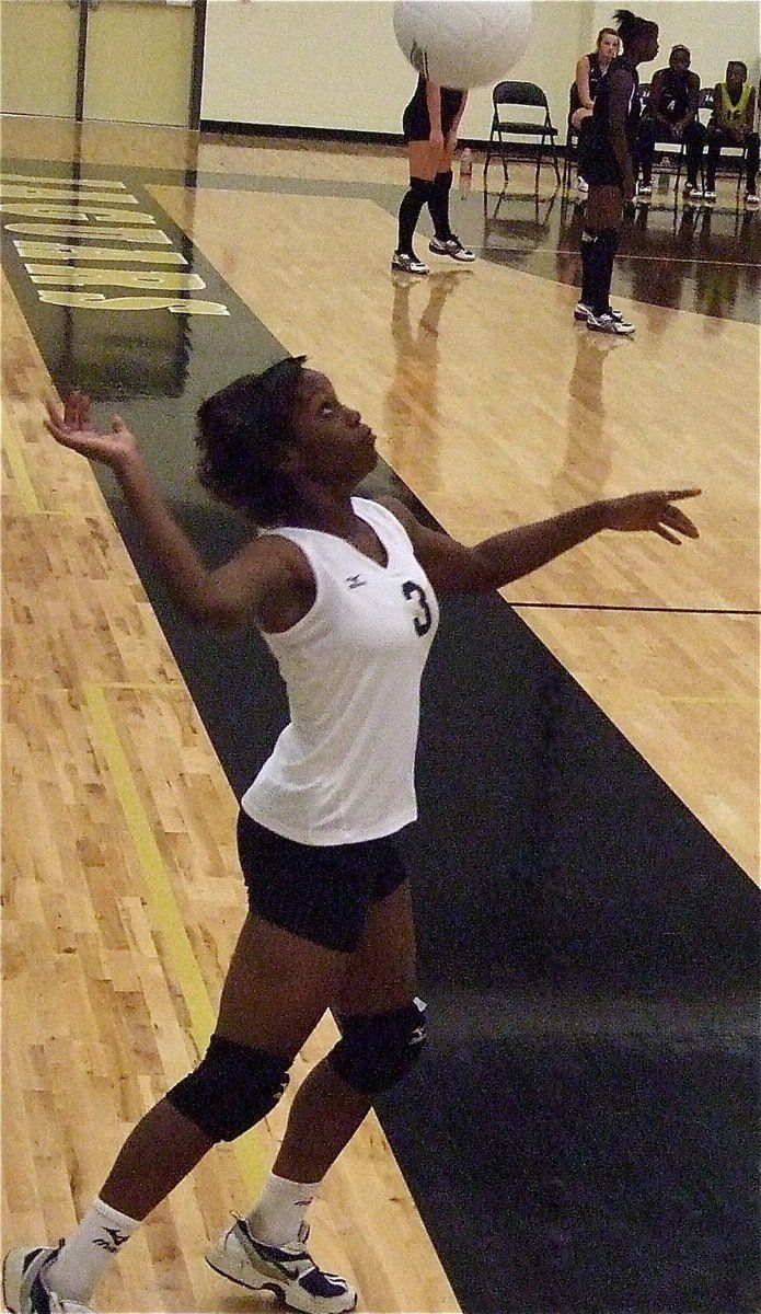 Image: Kortnei Johnson(3) takes her turn serving to the Lady Jaguars.