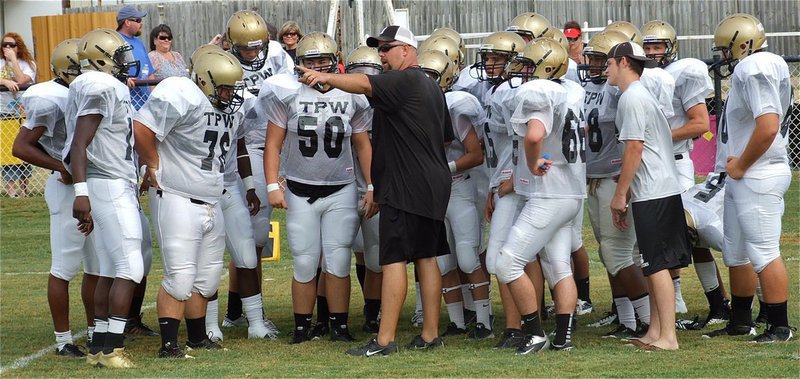 Image: Gladiator head coach Hank Hollywood directs his tough guys into battle against the Valley Mills Eagles for Italy first scrimmage.