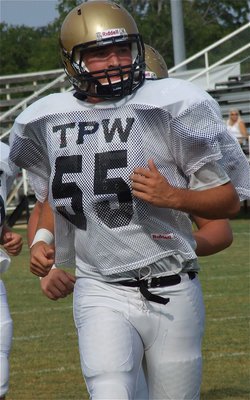 Image: Senior right tackle Zackery Boykin(55) is ready for some football. The letters TPW printed across the chest of Italy’s practice jerseys means, “Tough People Win,” the team’s motto instituted by Coach Hollywood this season.