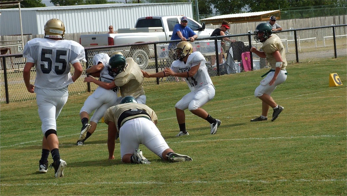 Image: Italy’s Shad Newman(25), a junior, fights for every extra yardage.