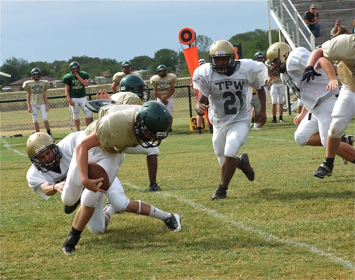 Image: Caden Jacinto(6), a senior, makes a tackle for a loss in the backfield against Valley Mills.