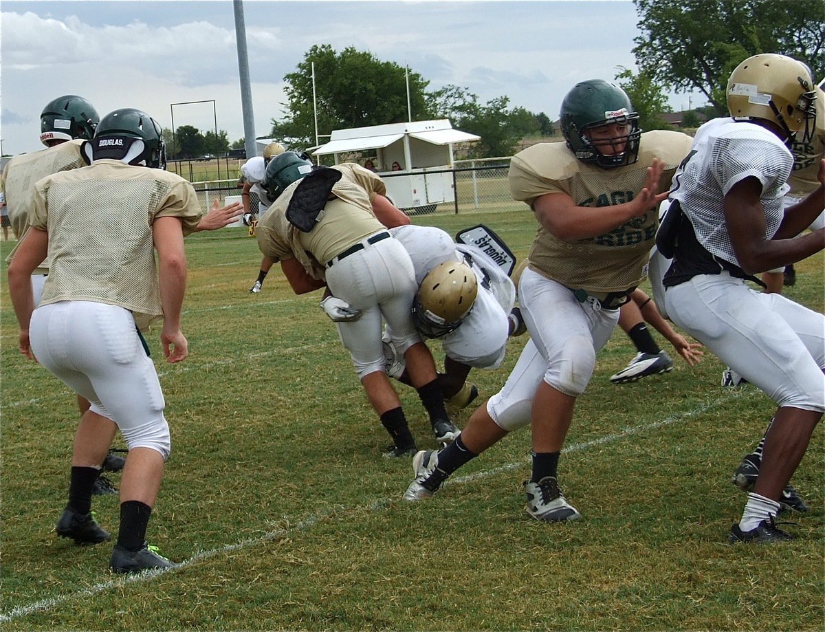 Image: Ryheem Walker spots an Eagle back trying to peck his way thru the Gladiator defense.