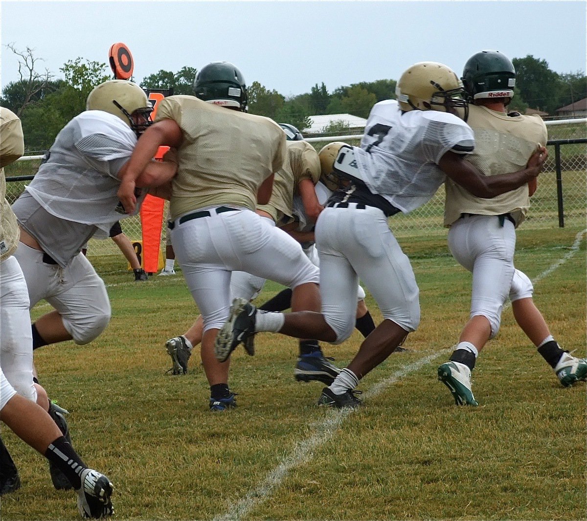 Image: Senior tackle Paul Harris(7) and junior noseguard Hank Seabolt(76) bull rush their way to the quarterback.