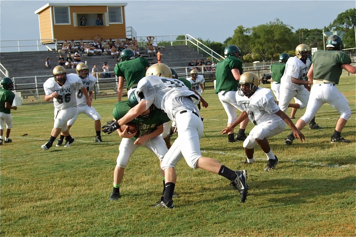 Image: Cody Boyd(30) captures an Eagle runner for a big loss to end bringing the first ten offensive plays segment of Valley Mills to a screeching halt.