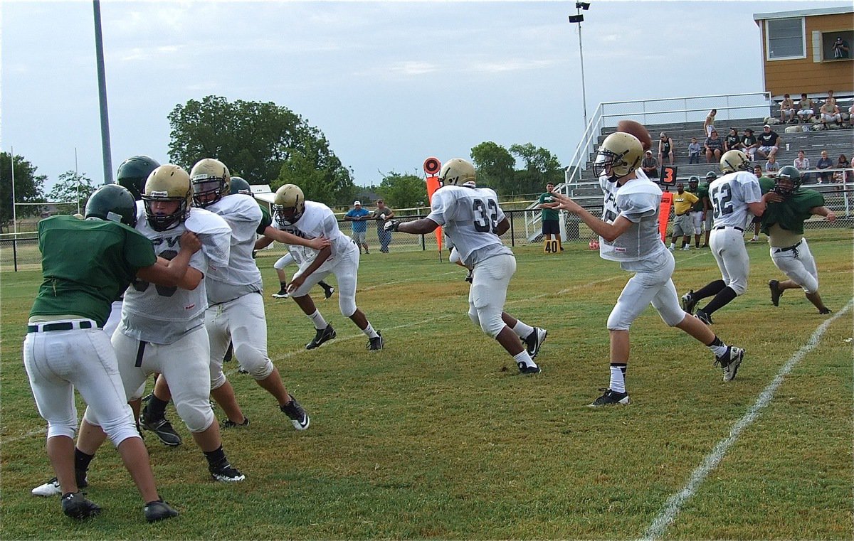 Image: JV quarterback Ryan Connor(15) gets solid protection from his offensive line and delivers a pass downfield to Cody Boyd who races to the end zone for a 38-yard touchdown.