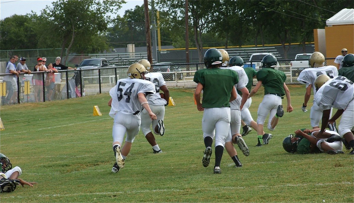 Image: The wheels on “The Bus” go round and round! Tre Jackson(32) keeps going and going for long run deep into Eagle territory.