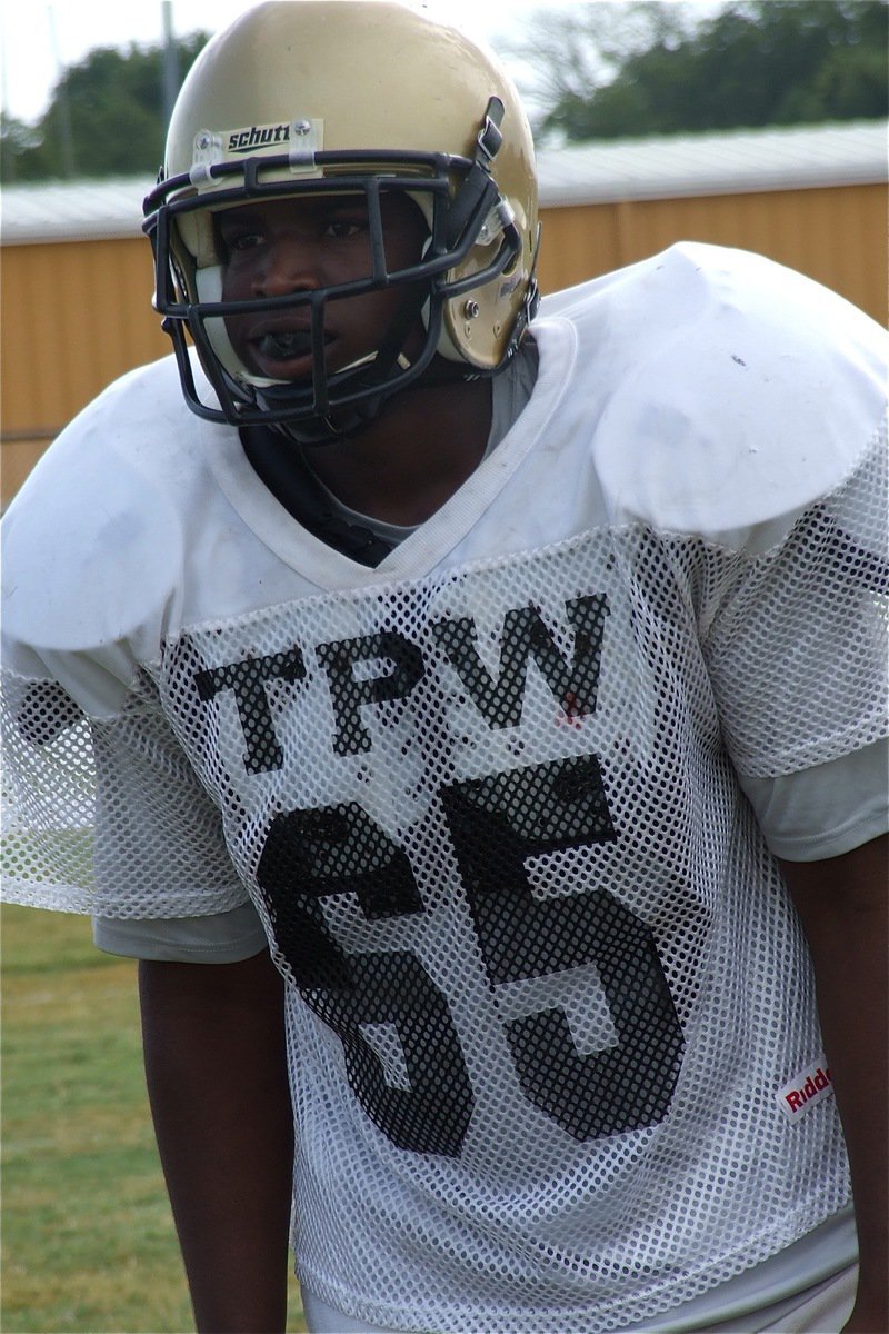 Image: Italy’s JV noseguard Justin Robinson(65) studies the offensive formation of Valley Mills.