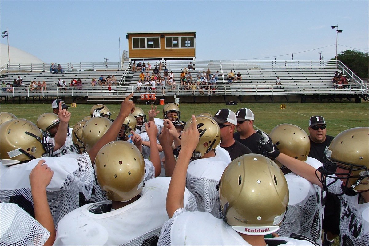 Image: Coaches bring Italy’s JV squad together at midfield to congratulate them on a job well done.