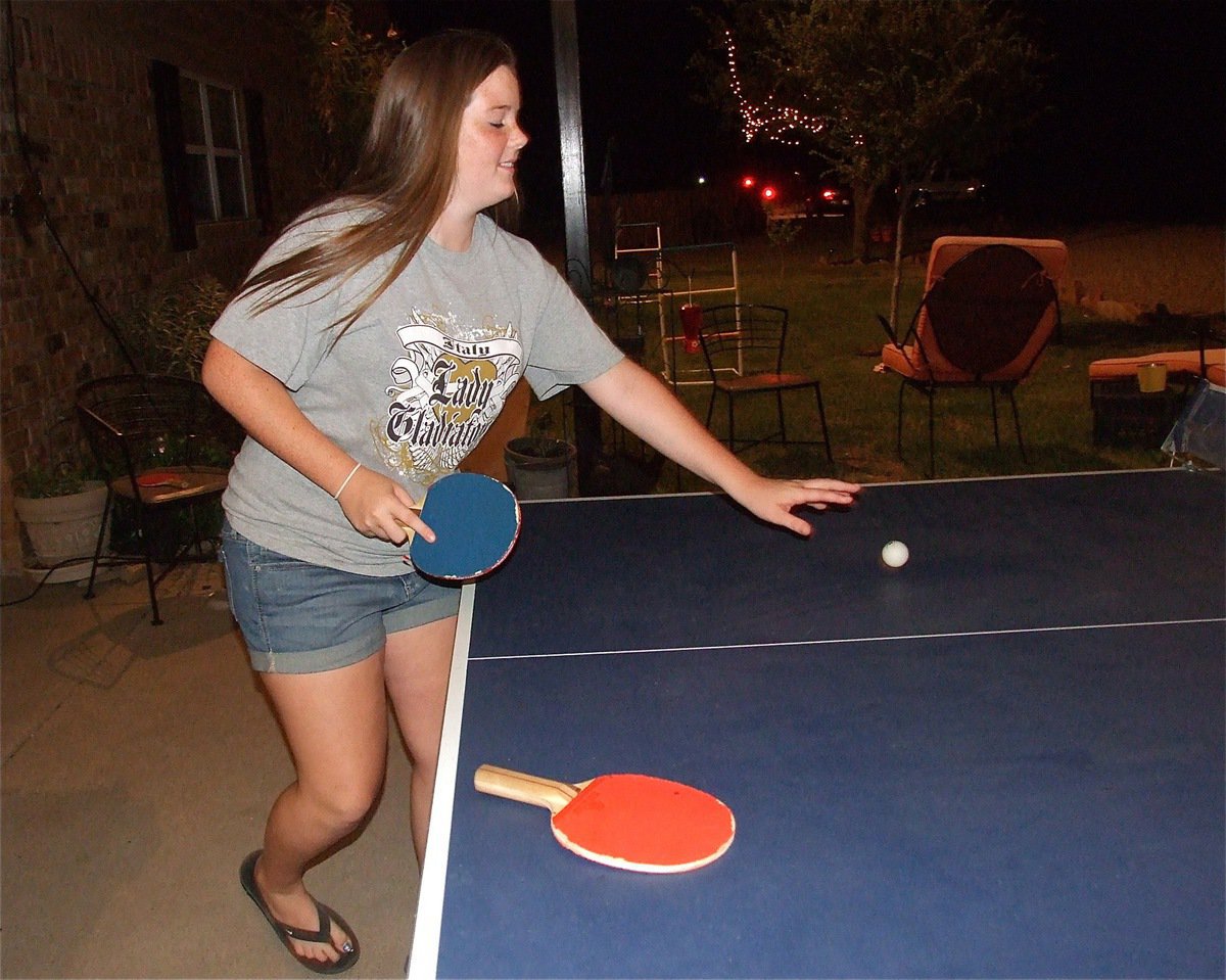 Image: Reagan Cockerham tries her hand at ping-pong.