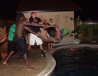 Image: Ryheem Walker and Cole Hopklins drop Freshman Jaray Anderson into the pool.