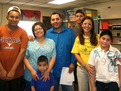 Image: The Celis family with Mrs. Aguado (fourth grade).