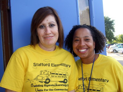 Image: Mrs. Galvan (P.E. Aide) and new principal Myla Wilson were meeting and greeting students and parents.