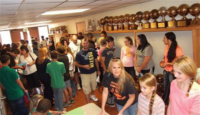 Image: Parents and students file in to the school for orientation.