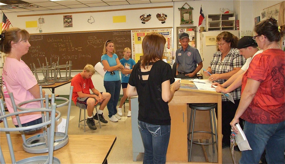 Image: Art instructor, Marilyn Seidlitz, greets parents and students.