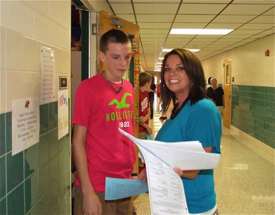 Image: IHS Alumni Cassy Windham helps her little brother Ty Windham who is a freshman.