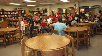 Image: Families file into the Library to meet Mrs. Sharan Farmer.