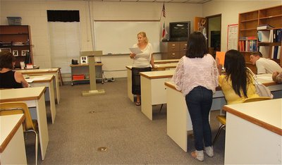 Image: FCCLA teacher Mrs. Melinda Hines talks with students and parents.