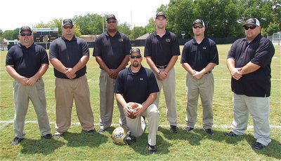 Image: The 2012-2013 Italy Gladiator Football Coaching Staff: Wayne Rowe, Brandon Duncan, Larry Mayberry, Nate Skelton, Josh Ward, Brian Coffman and AD/Head Coach Hank Hollywood on the front row.