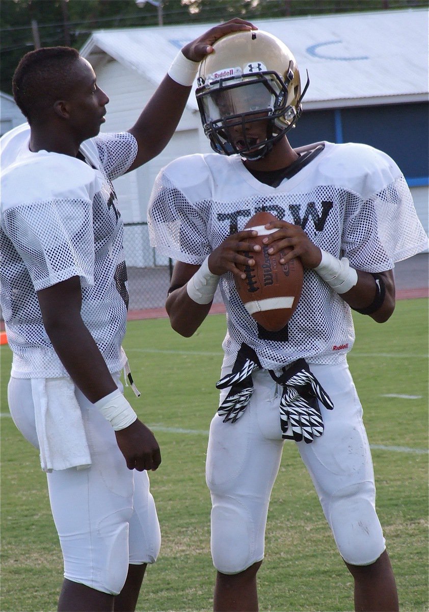 Image: Italy’s Marvin Cox wishes his quarterback compadre good luck before the Waco Reicher scrimmage.