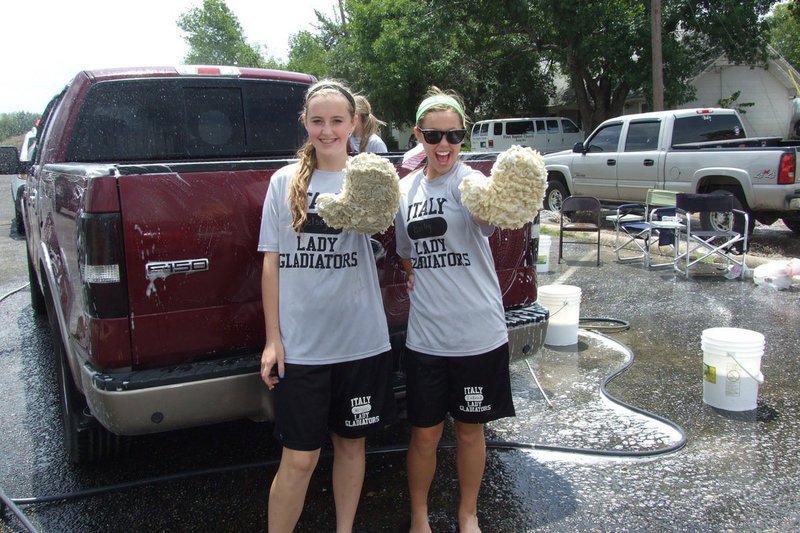 Image: Lady Gladiators Kelsey Nelson and Bailey Eubank are ready to clean cars.
