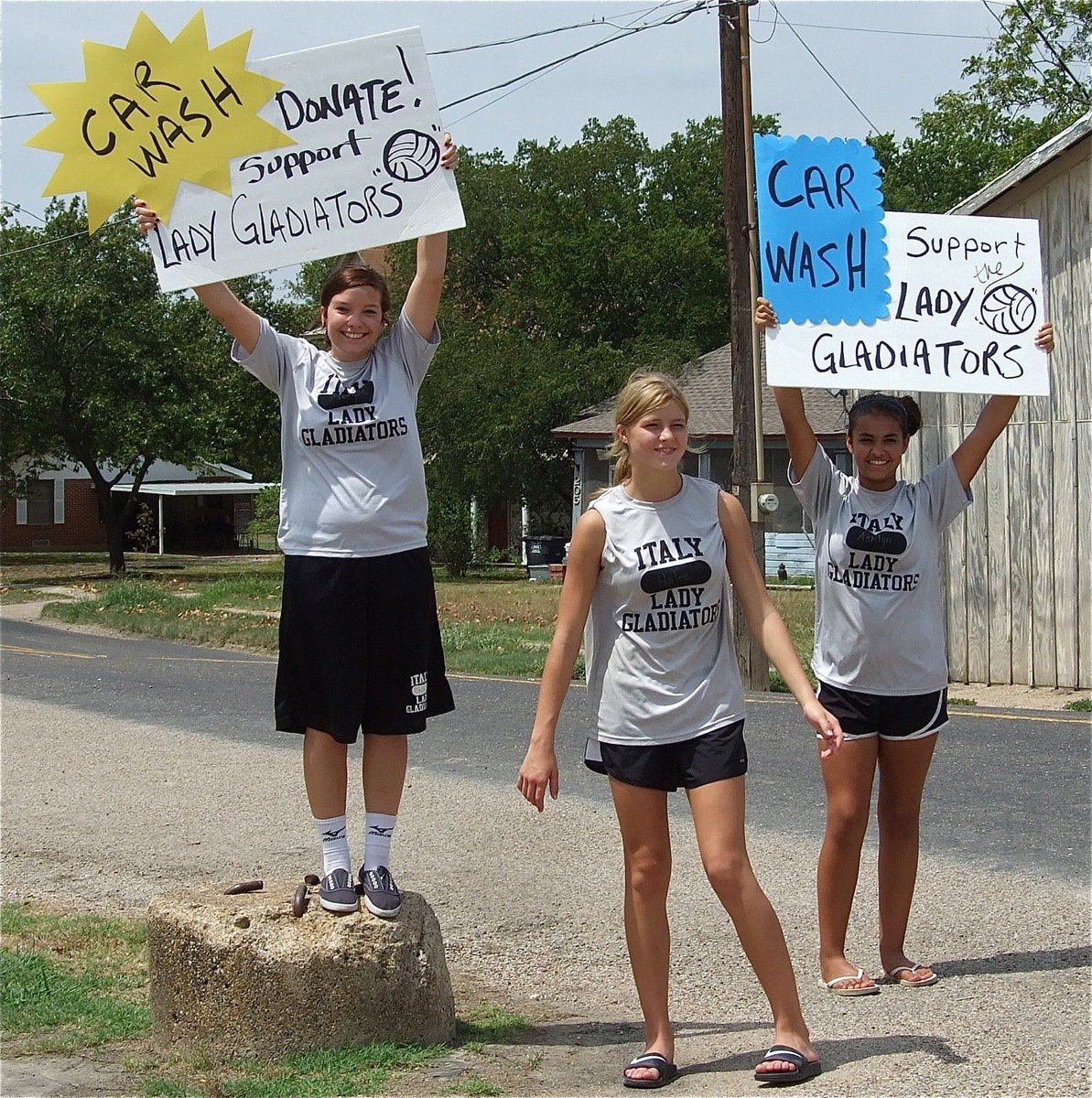 Image: Morgan Cockerham, Halee Turner and Ashlyn Jacinto keep compelling travelers to pull in for a quick wash and show support to the Lady Gladiators!