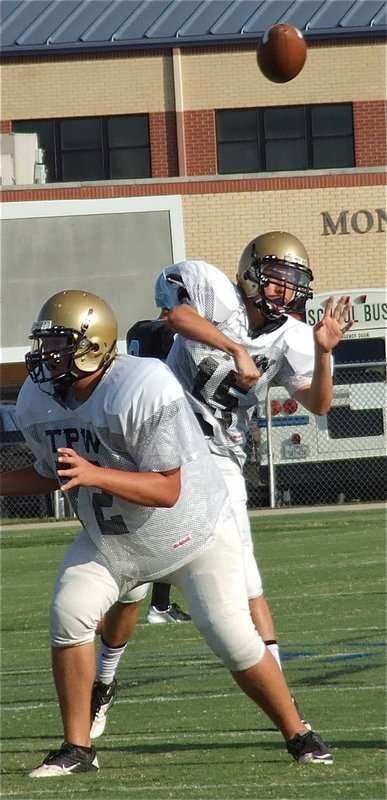 Image: JV Gladiator Colin Newman(72) protects his quarterback Ryan Connor(15) while he spots a receiver downfield.