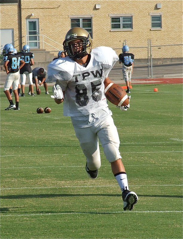 Image: Levi McBride(85) catches a pass during warmups.