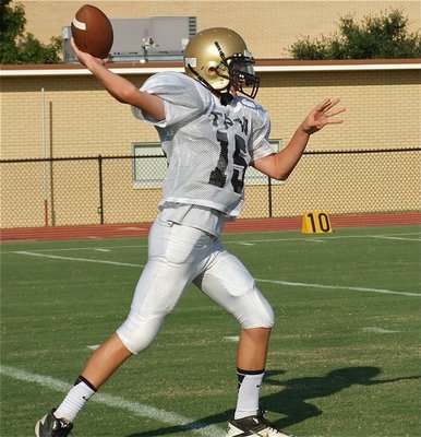 Image: Quarterback Ryan Connor(15) spots a receiver.