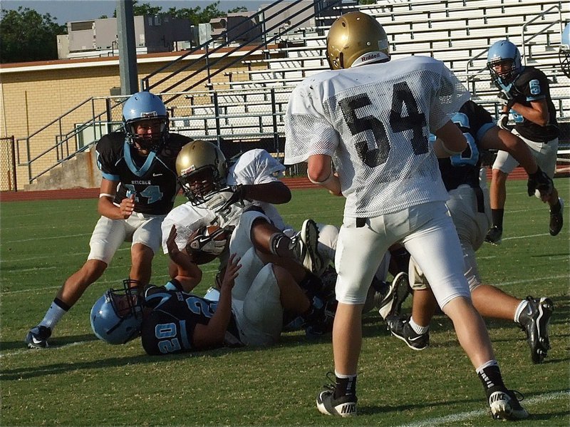 Image: Billy “The Bus” Moore(32) rolls over a few Cougar bowling pins.