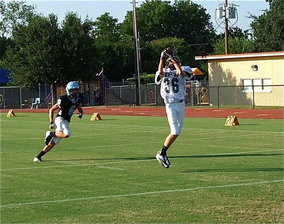 Image: The elusive Ty Windham(36) clutches a pass thrown by teammate Ryan Connor.