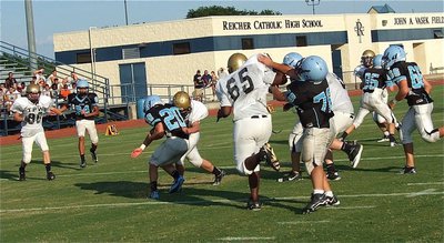 Image: Linebacker Kyle Fortenberry(66) fills the hole with authority to stop a Cougar in his tracks!