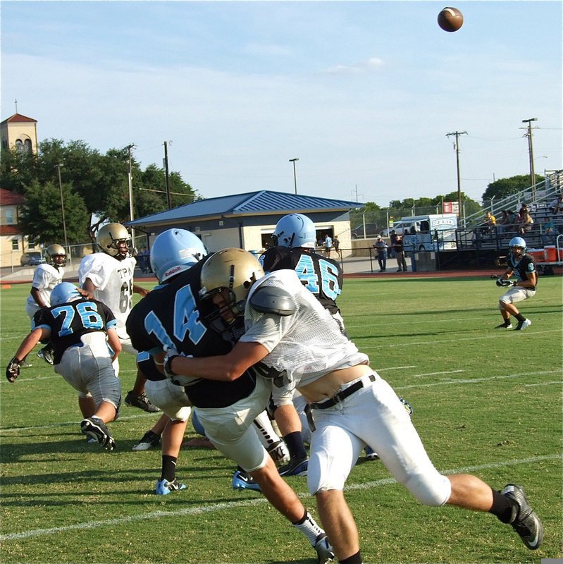 Image: JV Gladiator defender Hunter Merimon(84) lowers the boom on Waco’s quarterback during another successfully hard-hitting scrimmage for Italy.