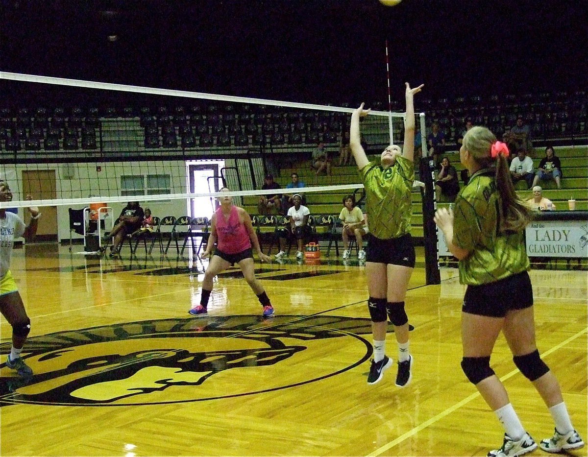 Image: Paola Mata(2) sets the ball for her group of Lady Gladiators.