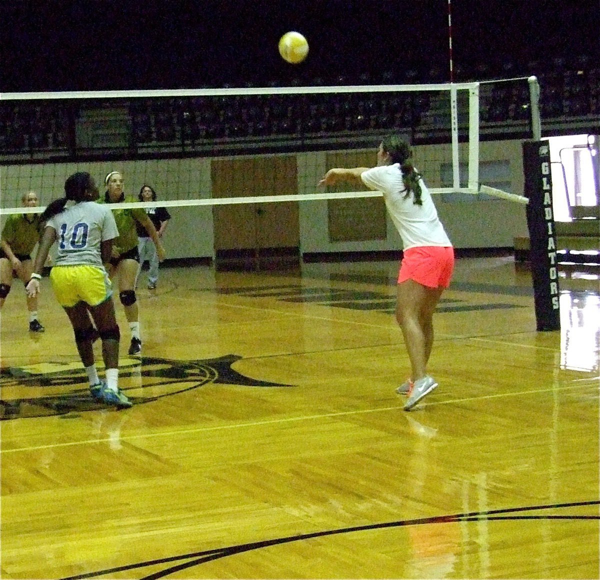 Image: Megann Lewis Harlow bumps the ball back over the net.