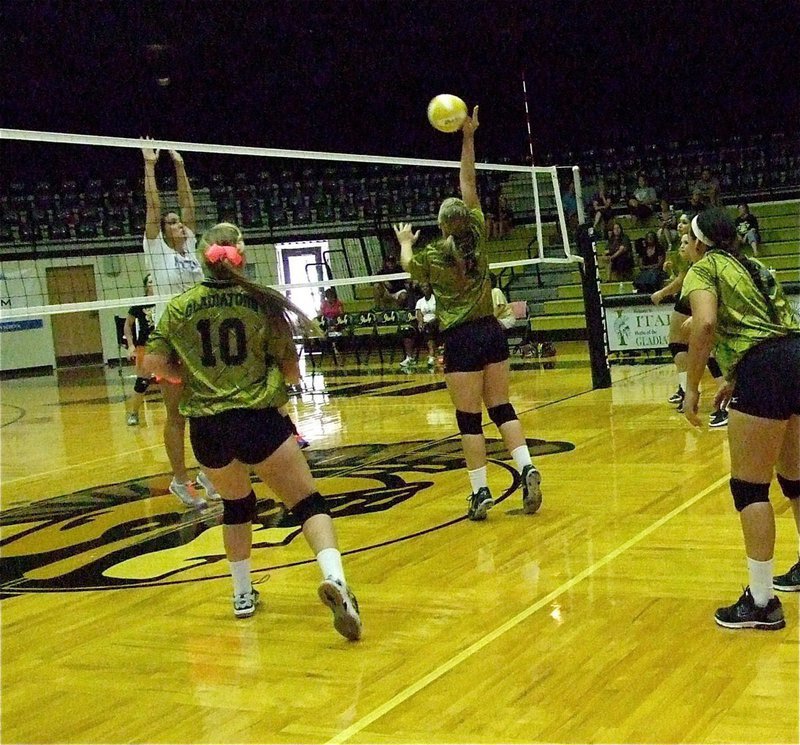 Image: Jaclynn Lewis(4) tries to sneak one past her big sister Megann Lewis Harlow.