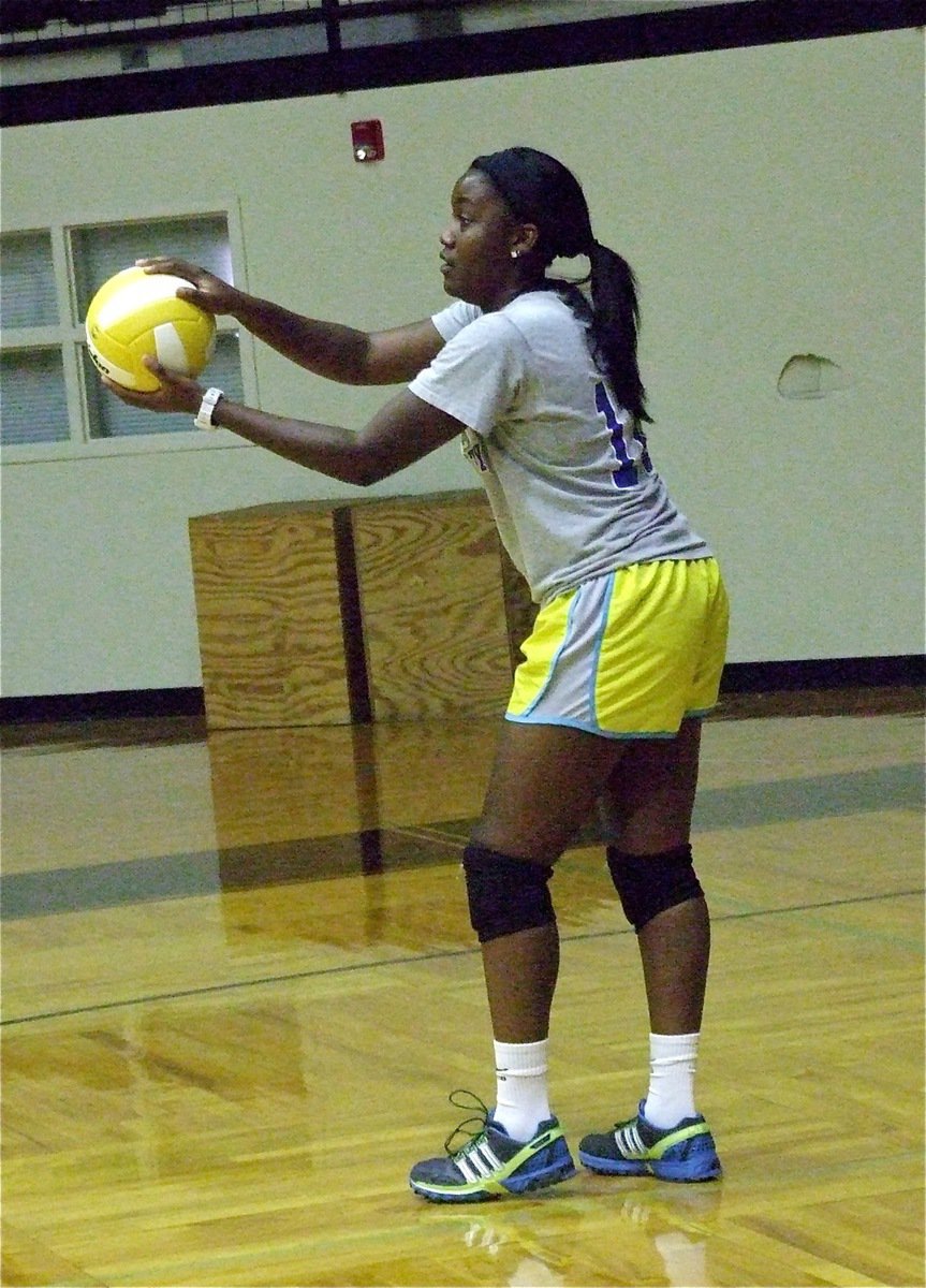 Image: Lady Gladiator head coach Jessika Robinson serves for the alumni team.