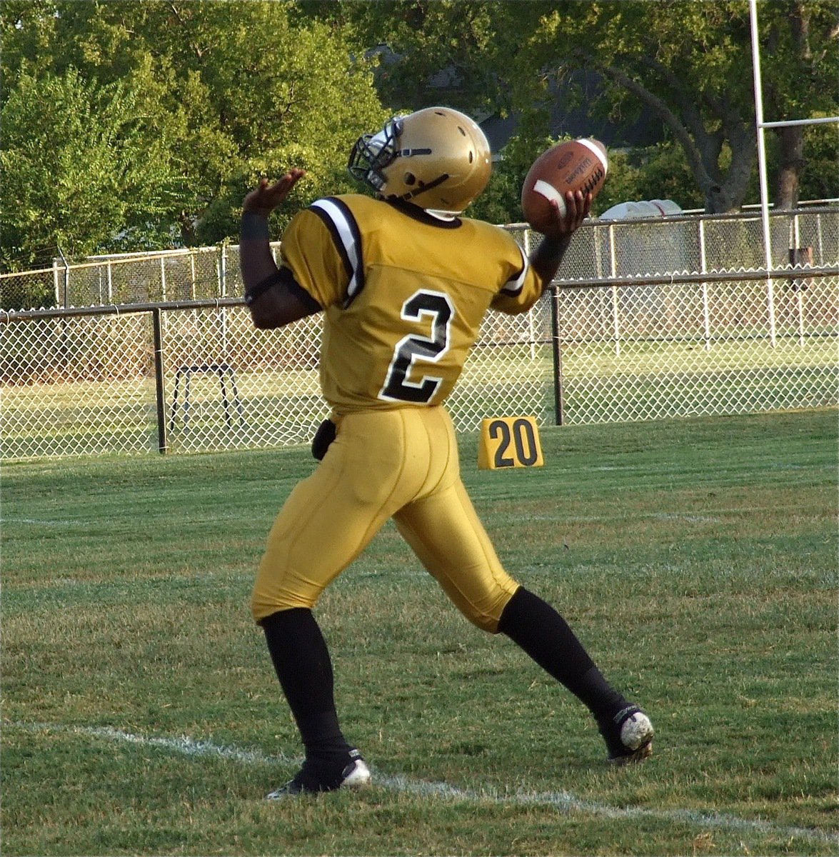 Image: Italy’s JV quarterback Marvin Cox(2) rares back for a pass against Maypearl.