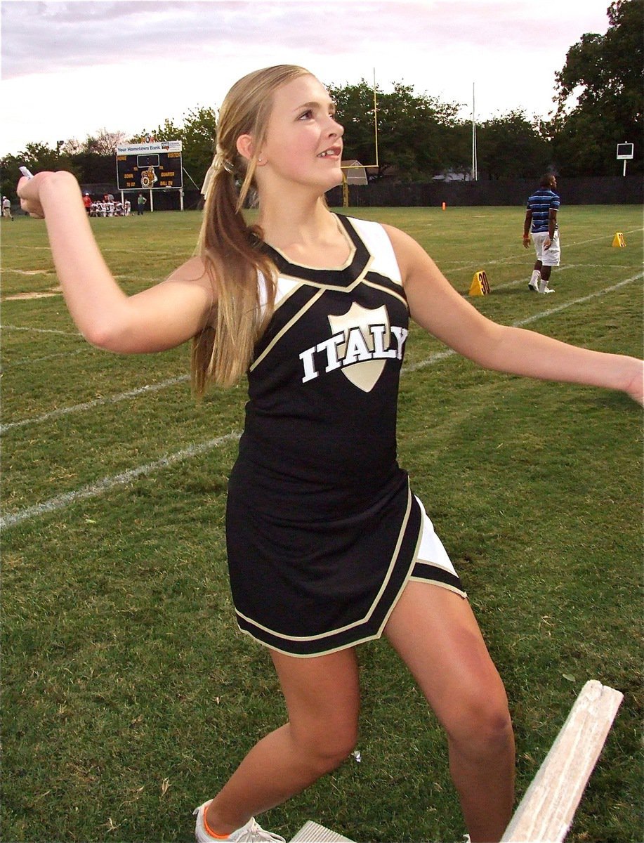 Image: IJH Cheerleader Annie Perry tosses candy to the fans after another Italy score. The JV Gladiators get the better of Maypearl 38-0.