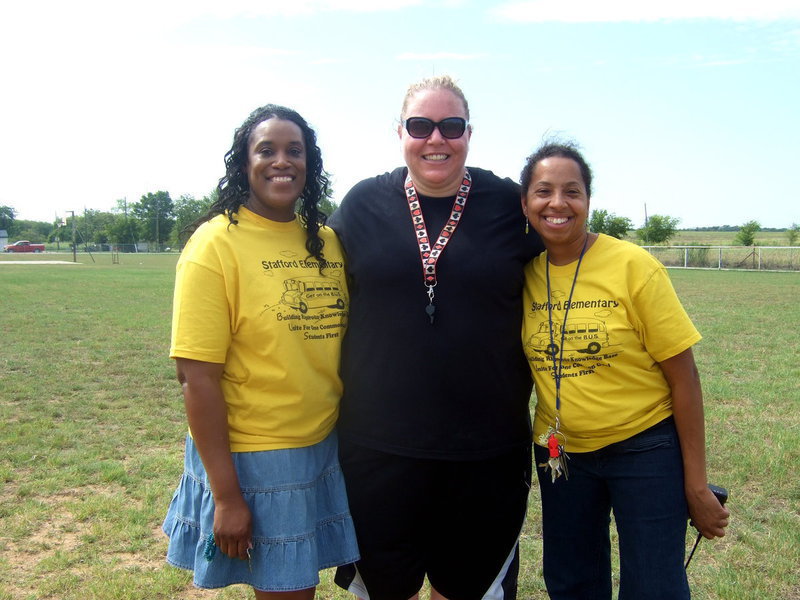 Image: Felicia Burkhalter (library aid), Melissa Fullner (P.E. teacher) and Principal Wilson all at Field Day.