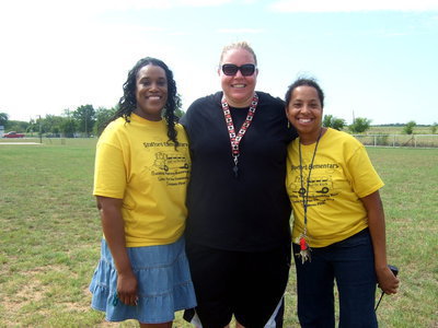 Image: Felicia Burkhalter (library aid), Melissa Fullner (P.E. teacher) and Principal Wilson all at Field Day.