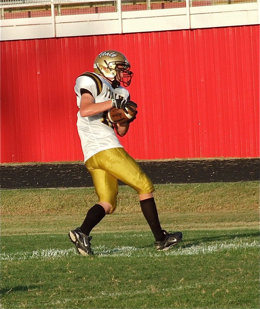 Image: Sophomore Gladiator Cody Boyd(15) pulls in a pass before making his varsity debut.