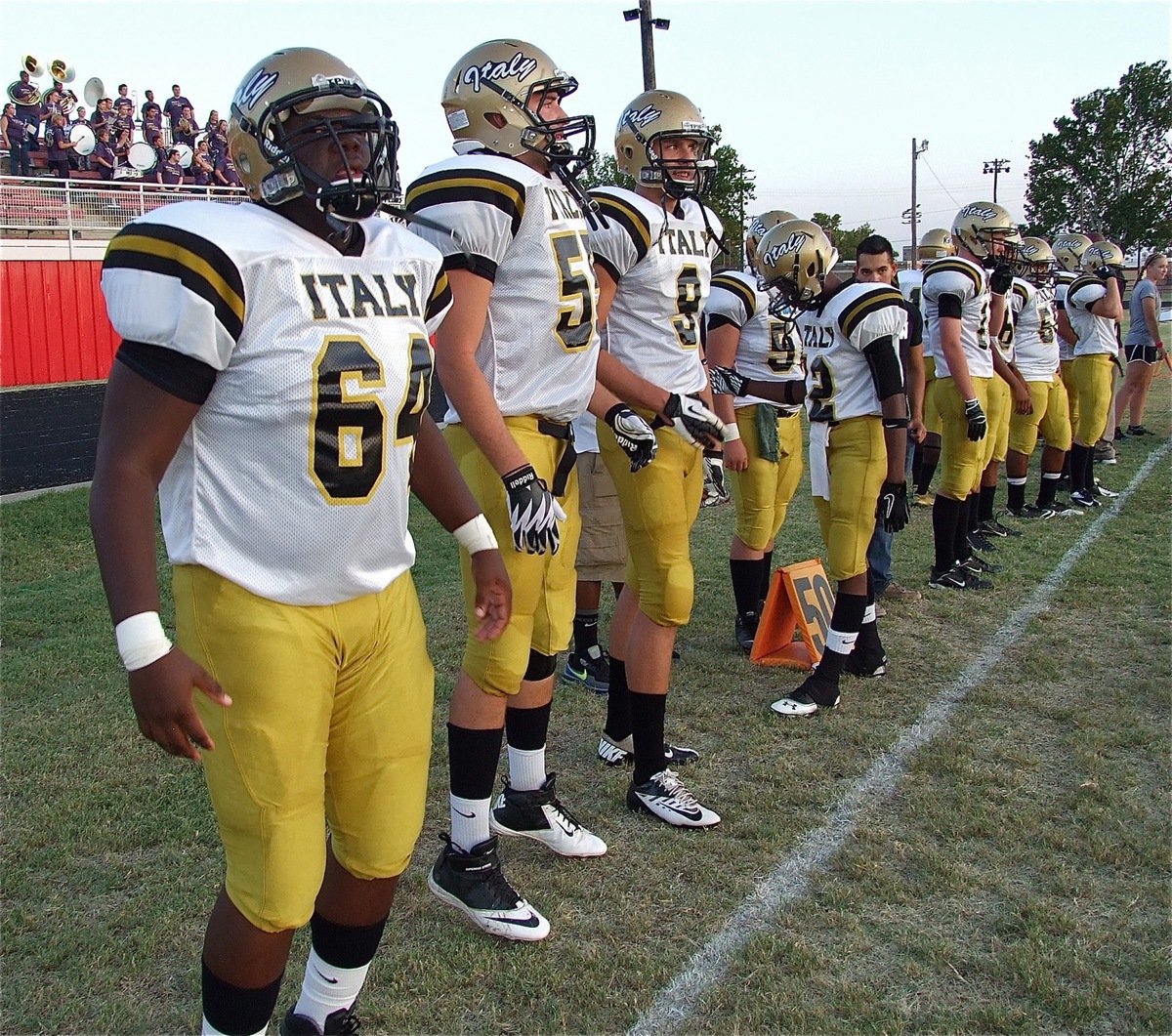 Image: Adrian Reed(64), Zackery Boykin(55) and Cole Hopkins(9) get ready to go against Maypearl.