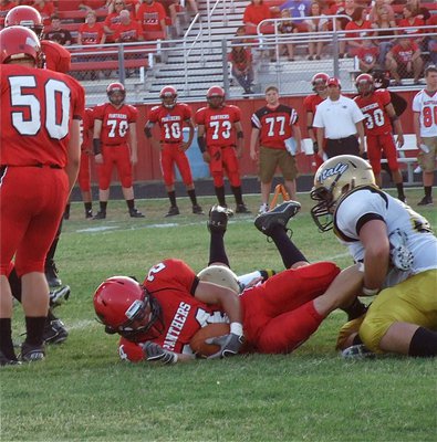 Image: Defensive tackle Zain Byers(50) brings down Maypearl’s top weapon Tristan Spradling(24). The fathers of both players, Barry Byers and Steven Spradling, were teammates for Italy in the late 80s.