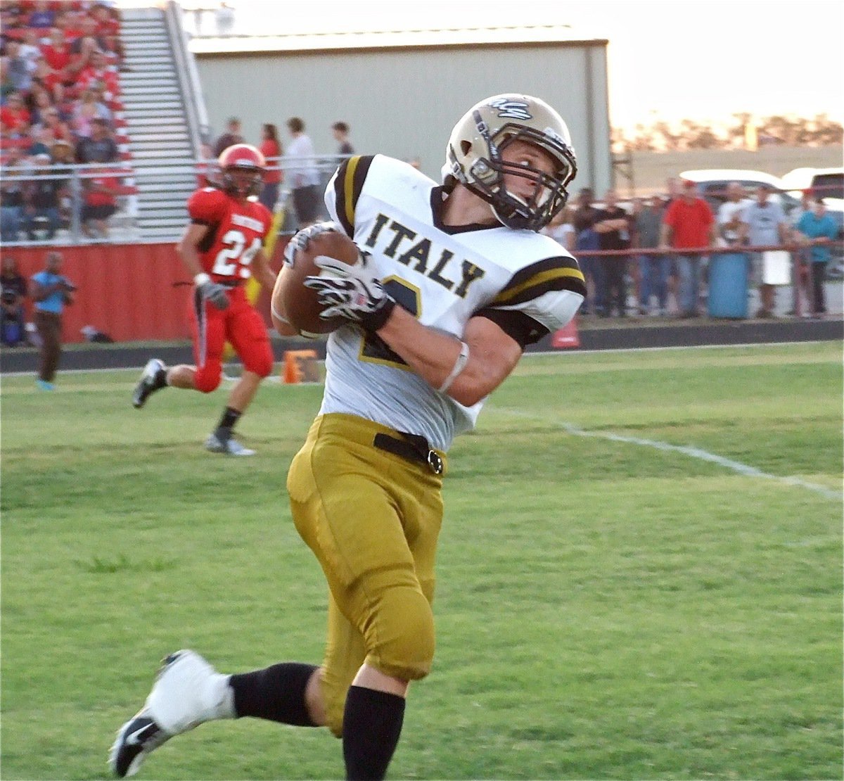 Image: Playmaker, Chase Hamilton(2), gets the scoring started for Italy with a 54-yard touchdown catch and run.